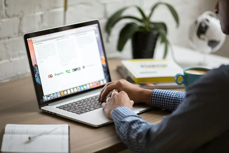 A person working on a laptop setting up email automation workflows for quiz lead magnet delivery